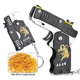 1pc Mini Toy Metal Gun with Rubber Band Fun Folding Pistol Key Charm Pendant Kids Birthday Gifts Toys Boy Girl Game Party Favors